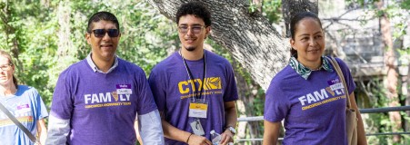 A student showing his parents around campus