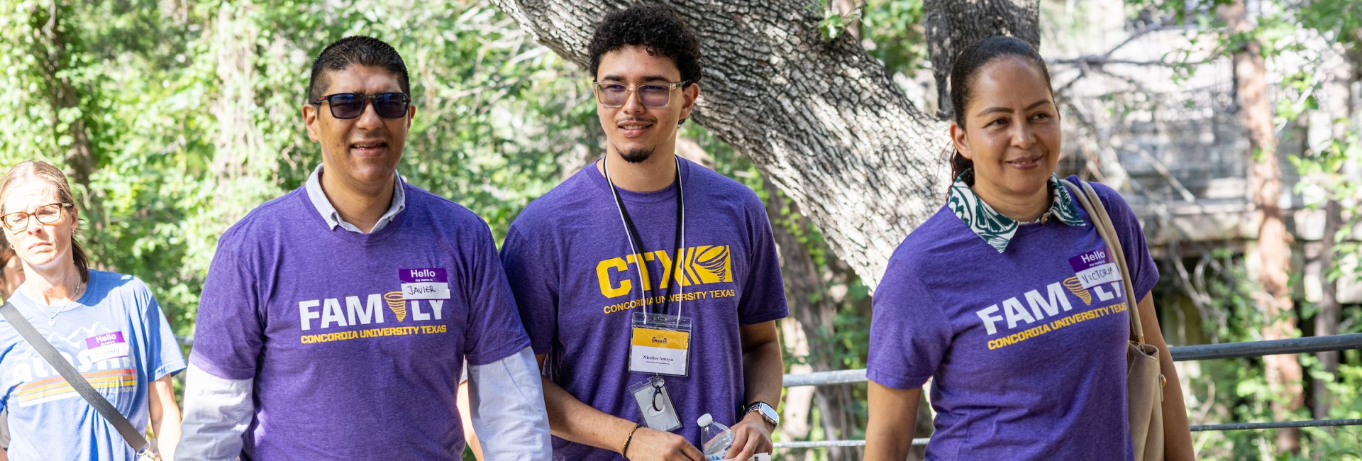 A student showing his parents around campus