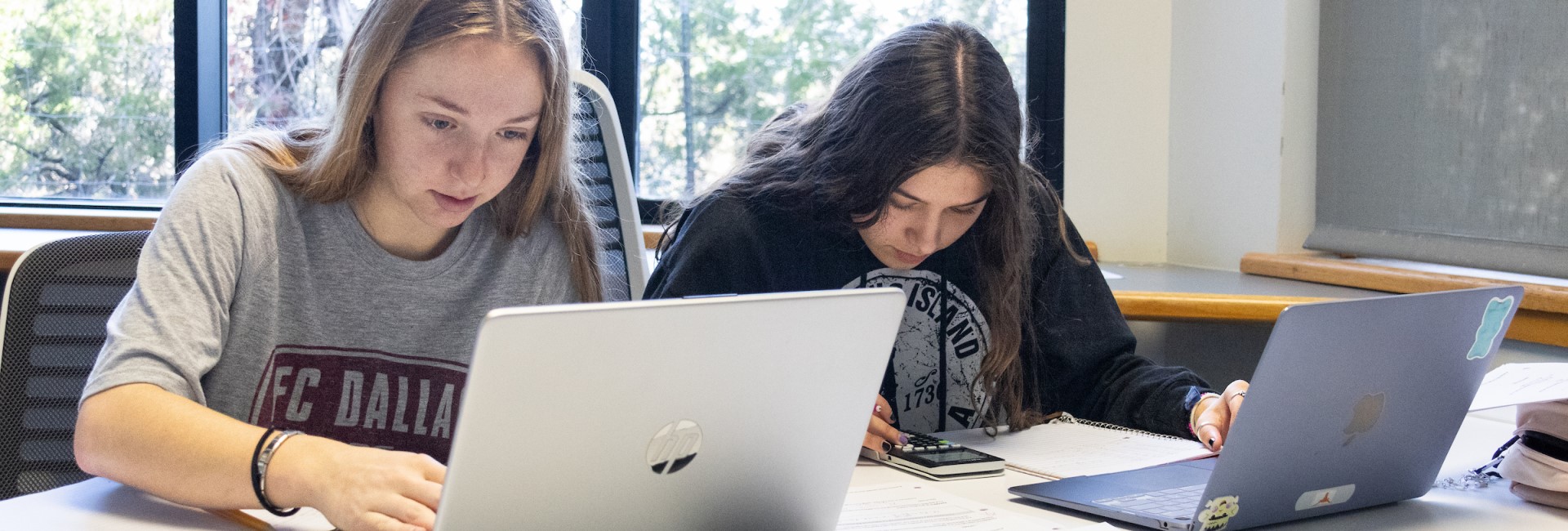 Students working in a study room on campus