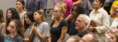 Students, Staff, and Faculty on Campus in Chapel together