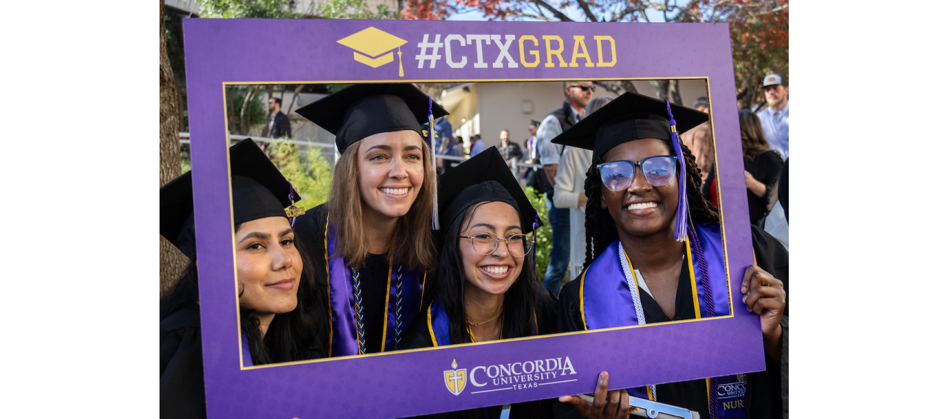 Students taking a picture at Commencement