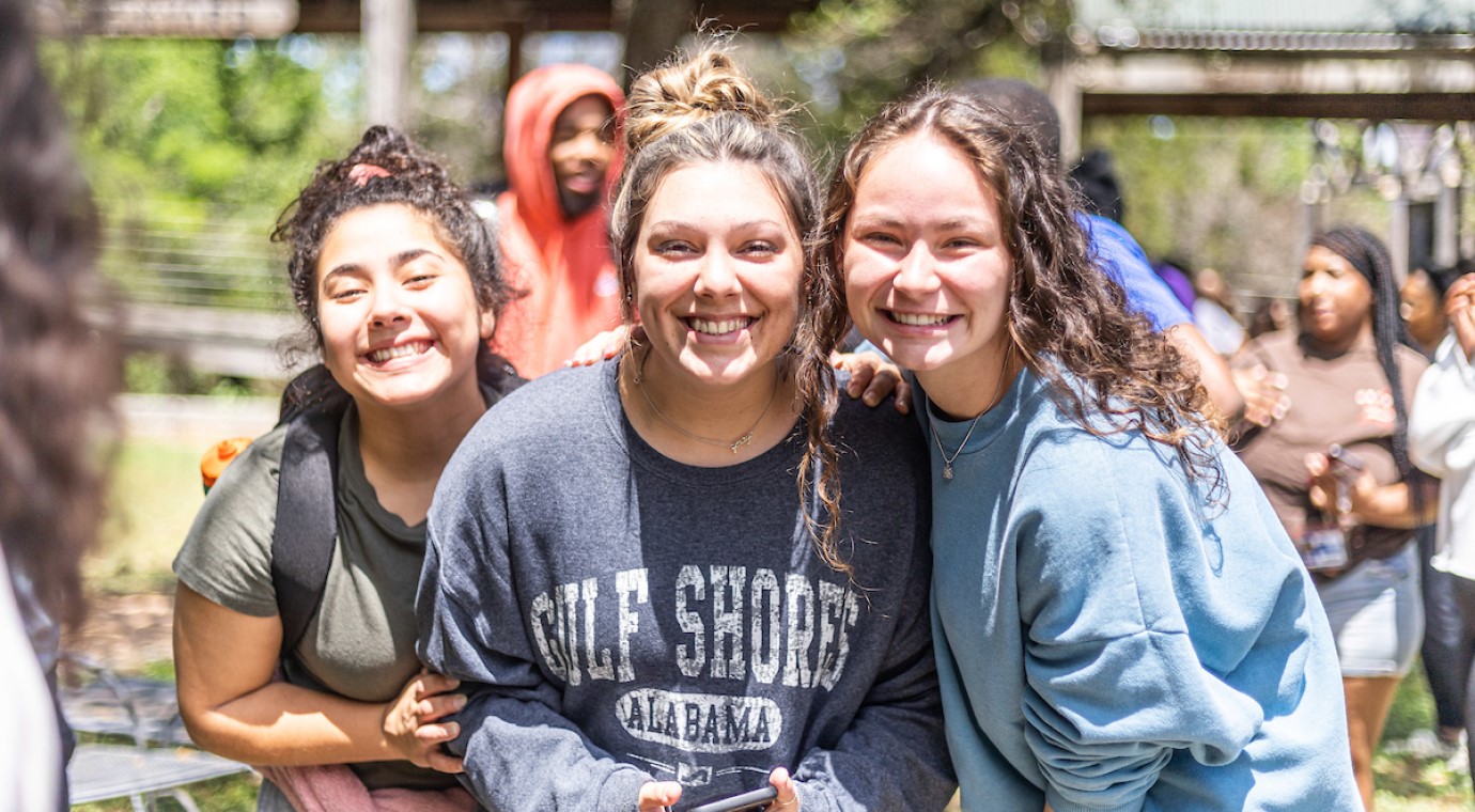 Group of CTX students posing for a photo on campus