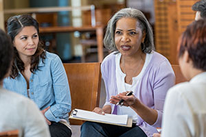 A psychologist leading a group session