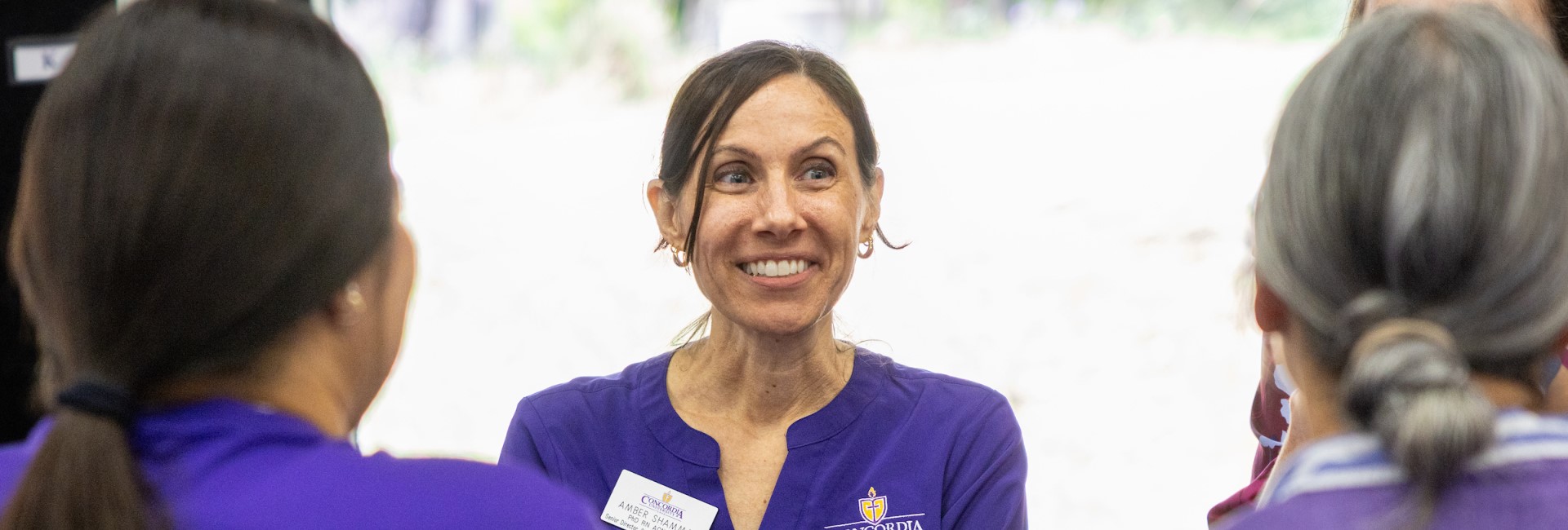 Faculty and students at Concordia conversing