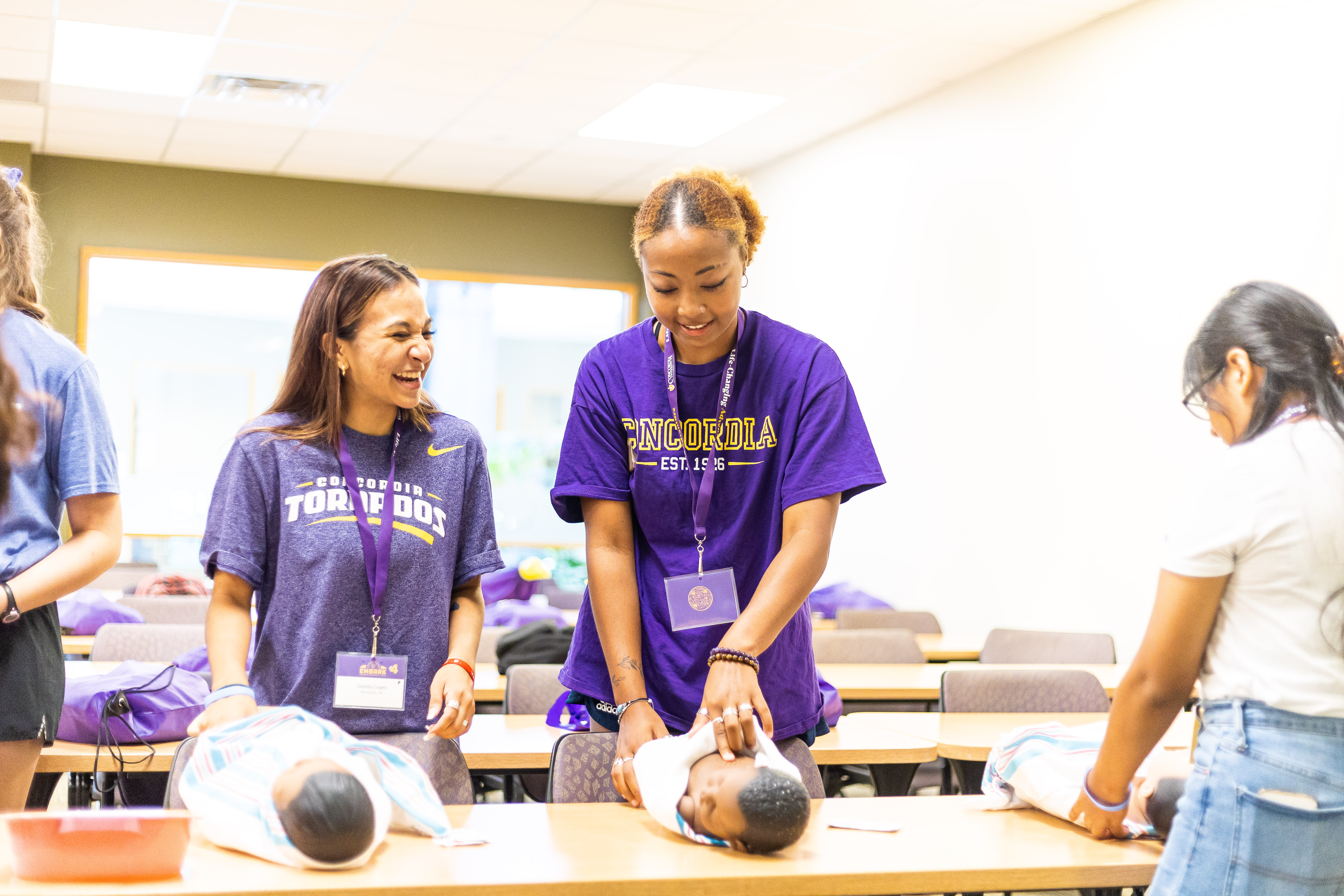 Healthcare Students and baby mannequins in a class.