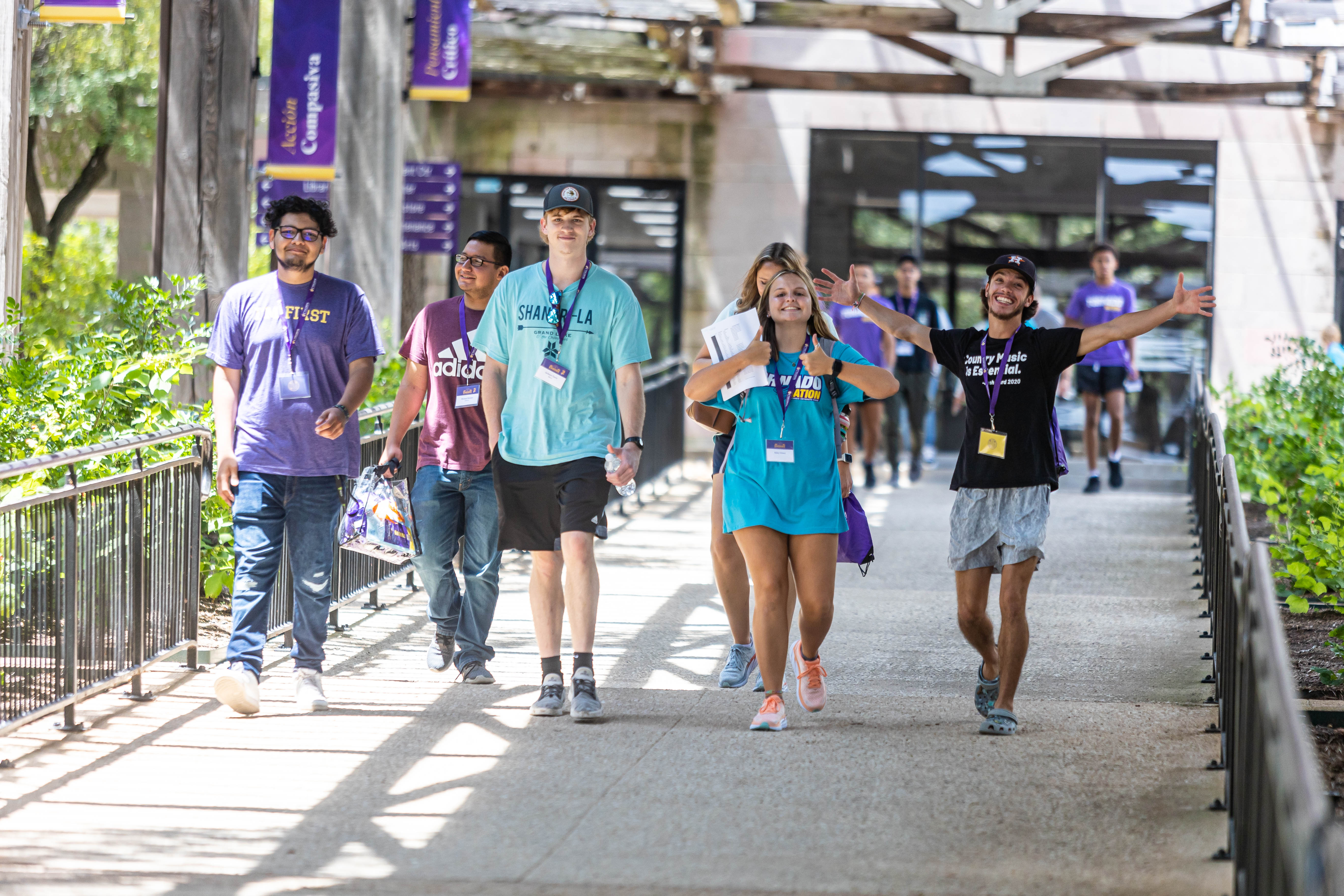 Students walking between buildings on campus.