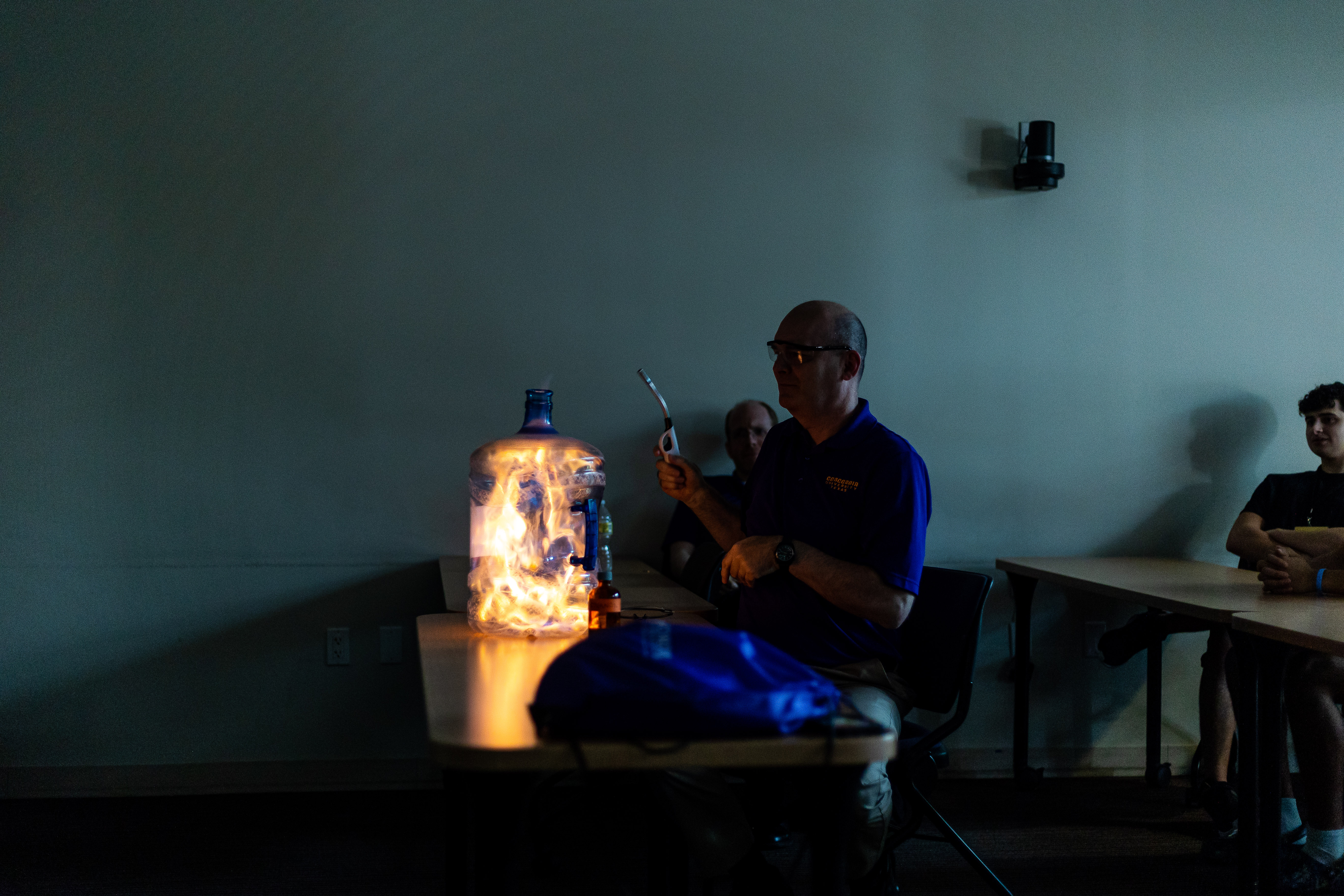 A professor and a bottle of fire.