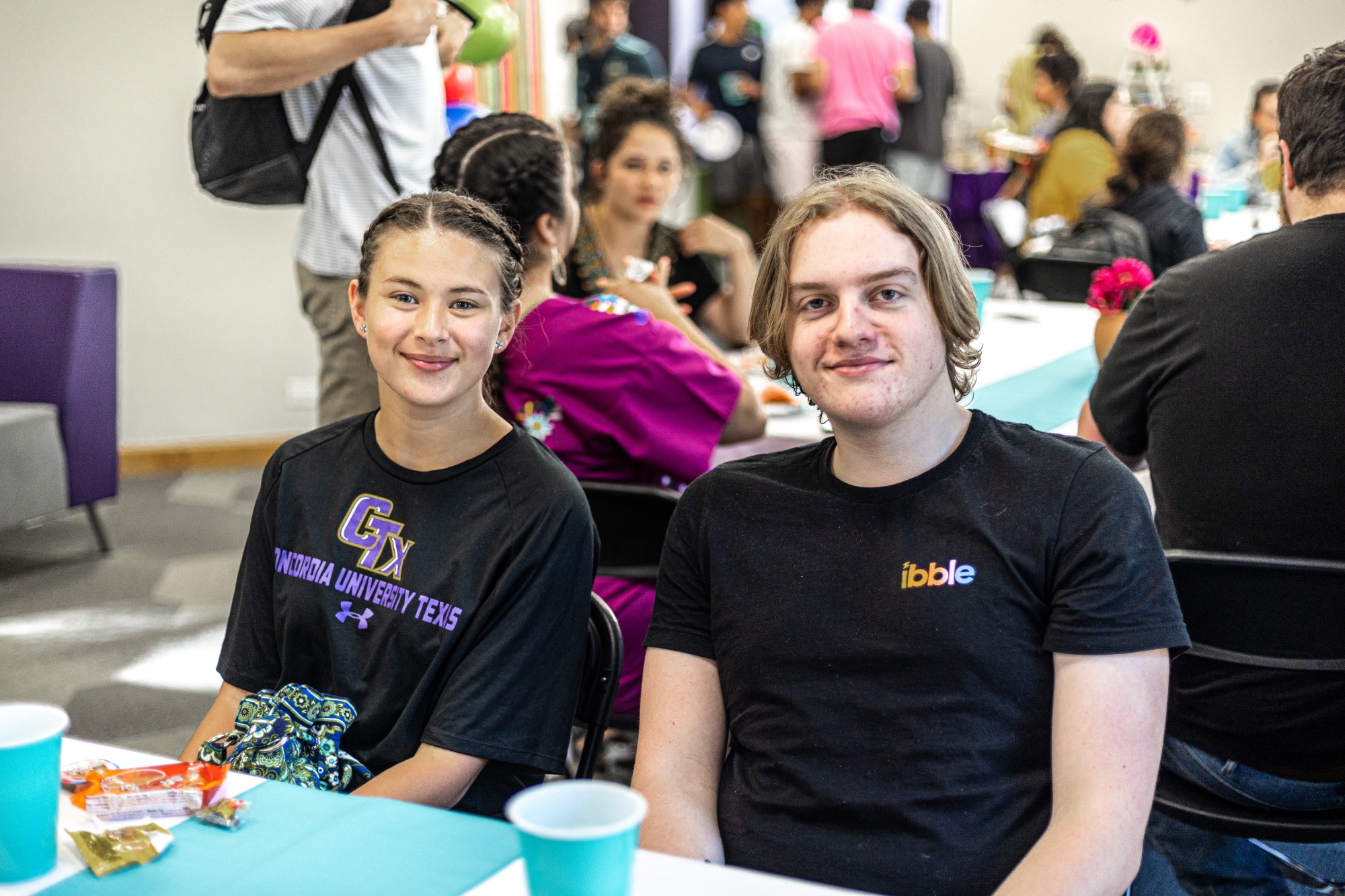 Students enjoying food and community.