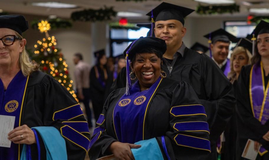 Graduate students heading to be hooded.