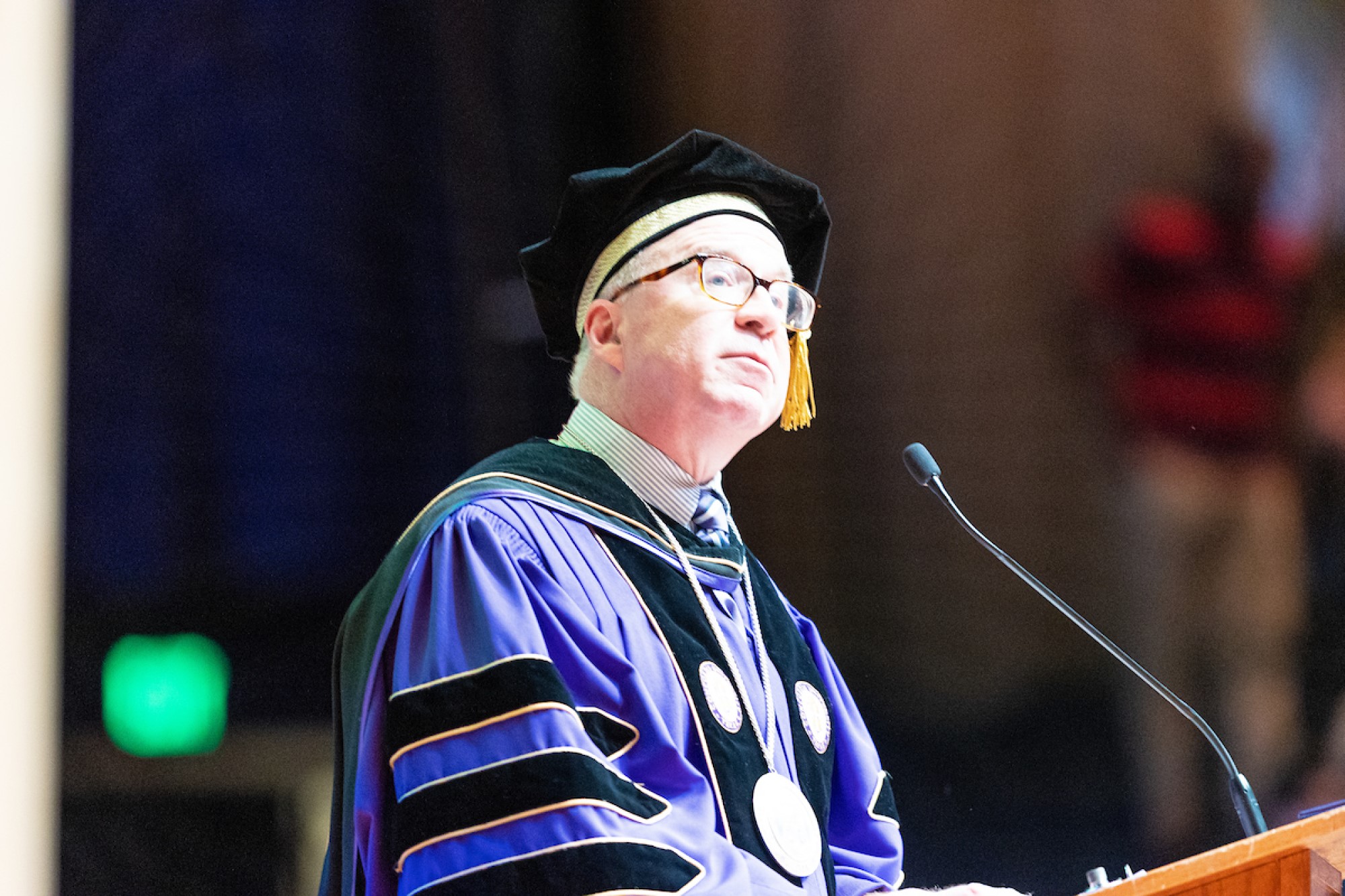 Dr. Christian delivering a commencement address