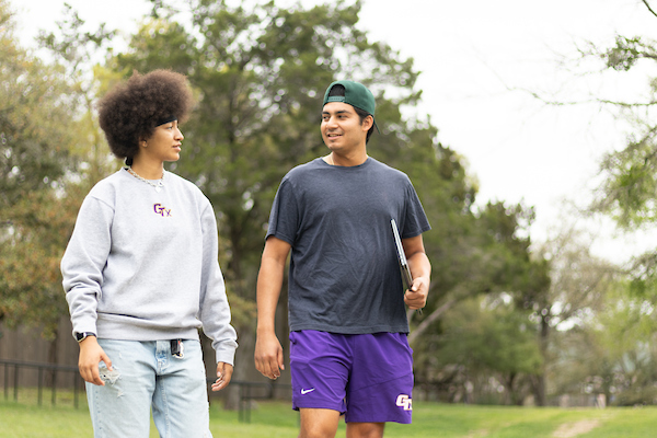 A pair of Concordia University Texas students on the scenic campus grounds