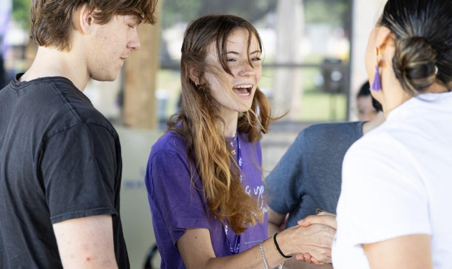 A student expressing happiness in her choice to go to Concordia University Texas.