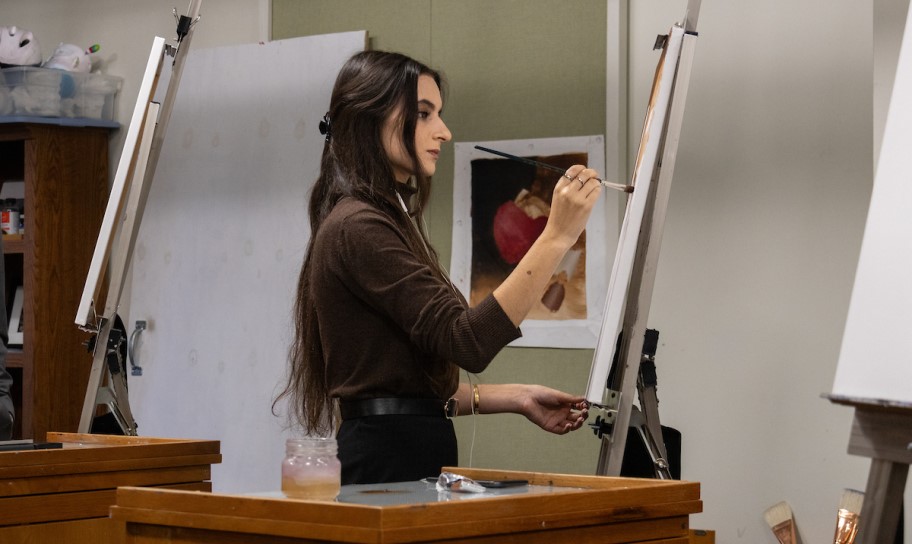 Concordia Texas student working on a painting