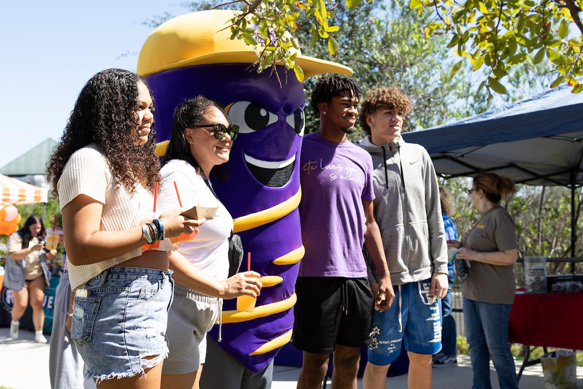 Students getting a picture with Vortex