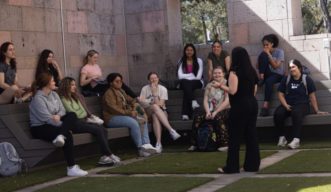 A professor teaching outside on the beatiful Concordia campus.