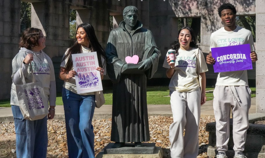 Sstudents at Luther Park and the statue of Martin Luther