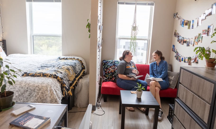 Students relaxing in their on campus dorm room