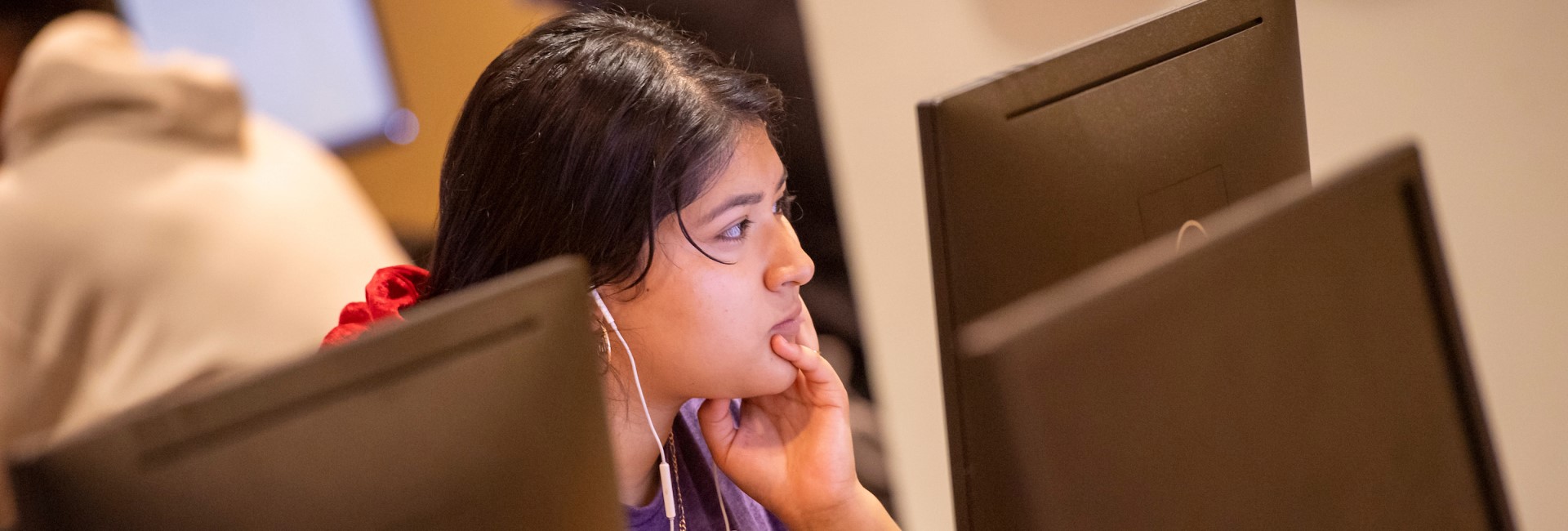 Concordia University Texas student using the computer lab on campus