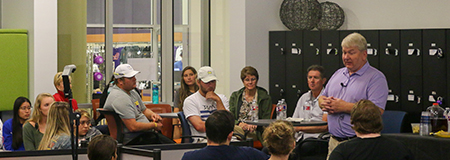 Students on Campus learning from a business professional