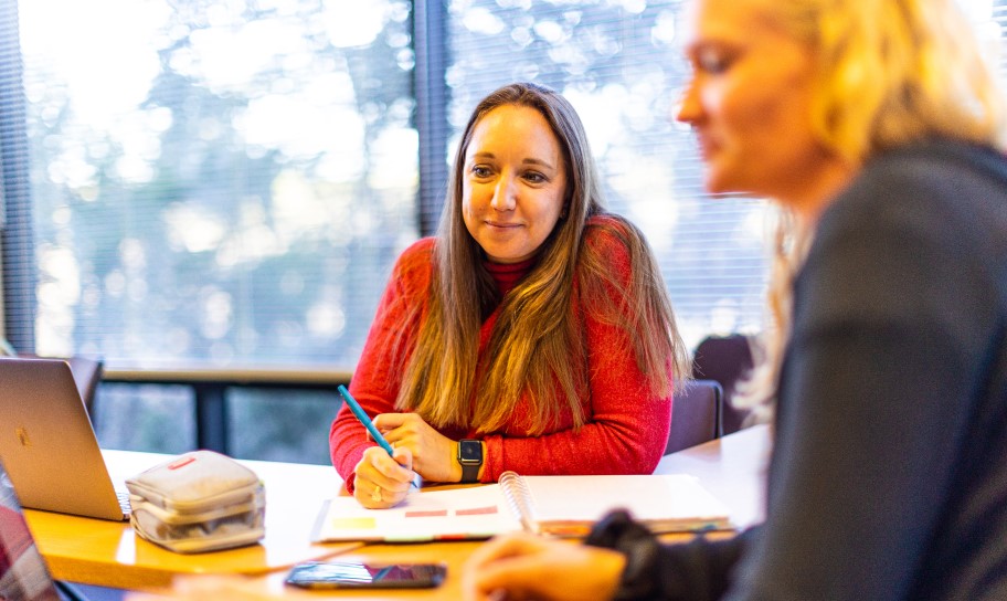 A professor and student working in a coaching and sports administration class.