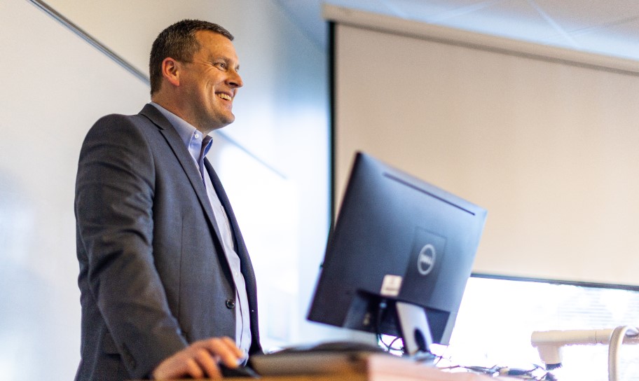 A professor teaching a coach and sports administration class.