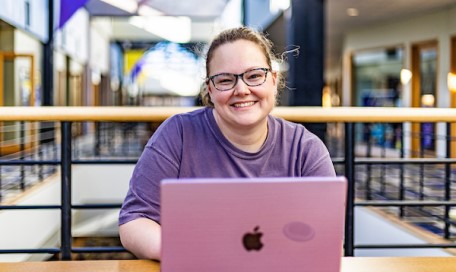 A CTX student working on her laptop