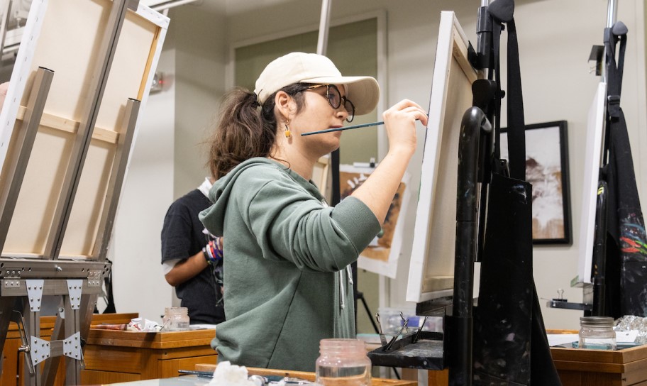 Concordia Texas Art student creating a painting