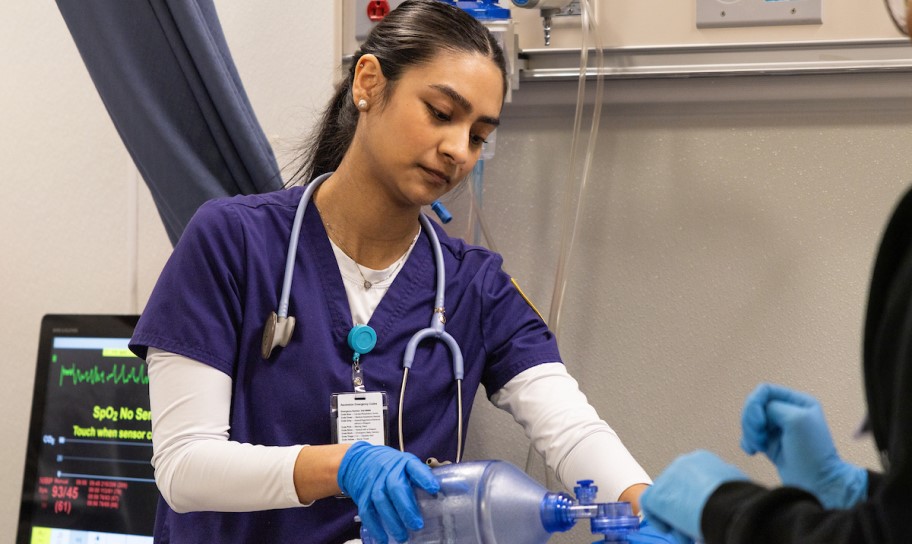 A nursing student working in a lab.