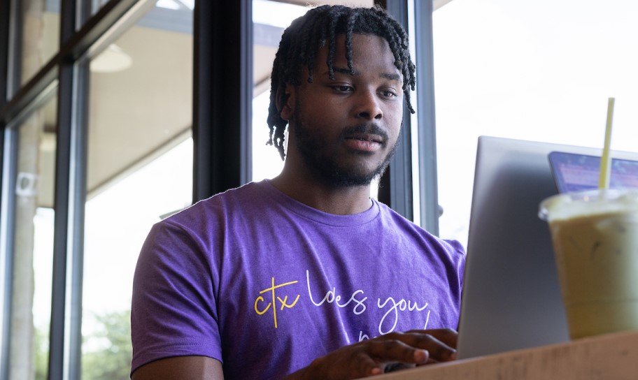A Concordia Texas student working on a laptop