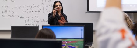 Dr. George teaching a class in computer science