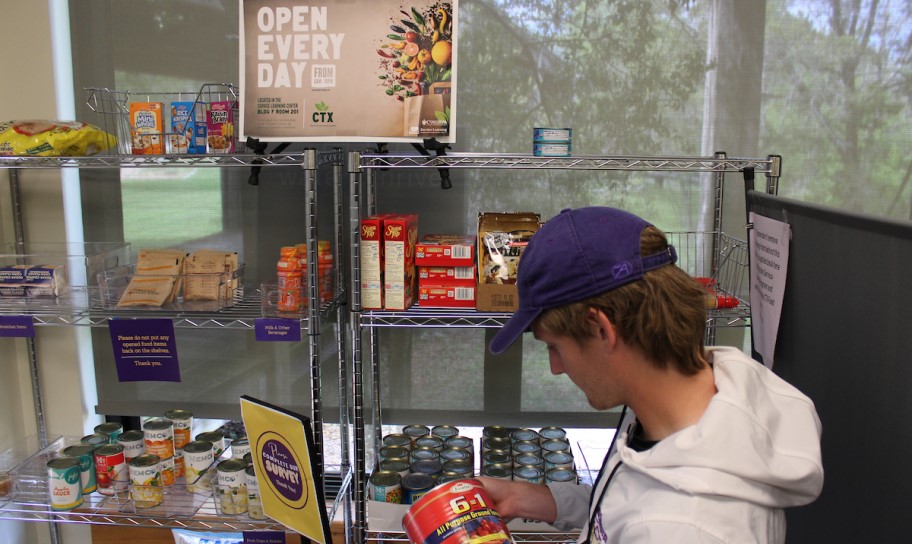 A student getting some food items from the campus pantry