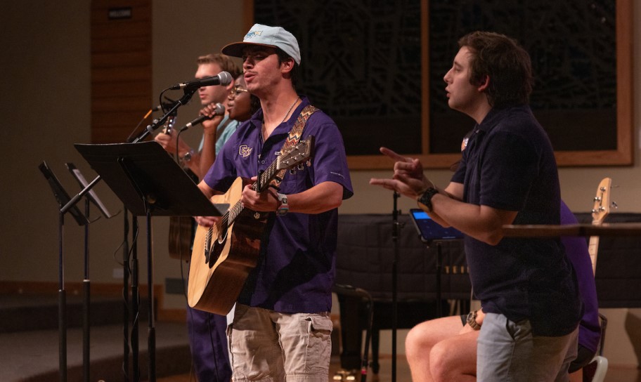 Students performing music during a chapel service