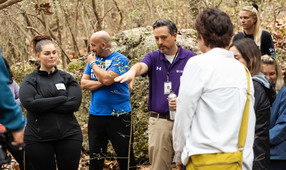 Concordia Texas professor leading a group of students on a field survey