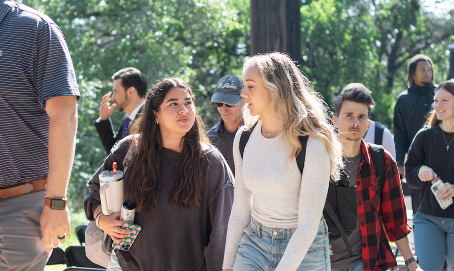 A pair of students discussing the previous lesson
