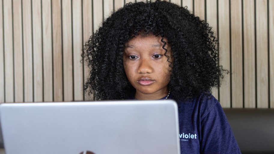 A student working on her laptop