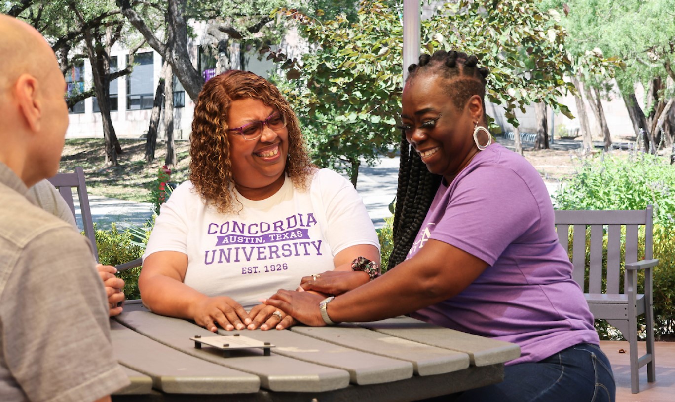 Graduate Students studying on campus