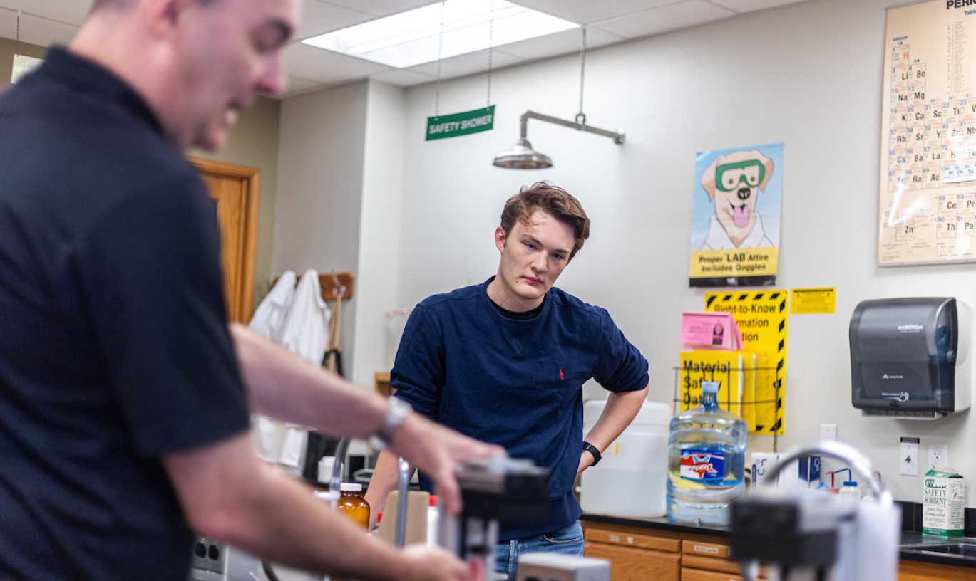 Concordia Texas faculty giving hands on instruction to a transfer student