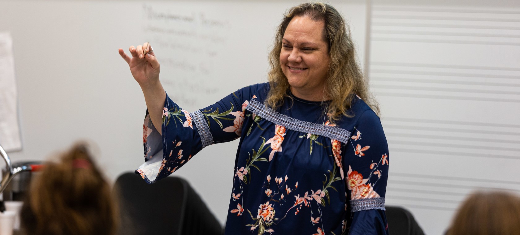 Concordia University music director leading a high school music camp