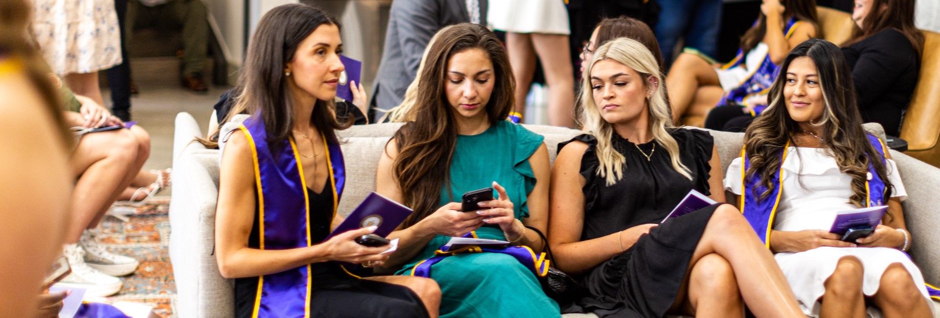 Alumni exchanging contact information