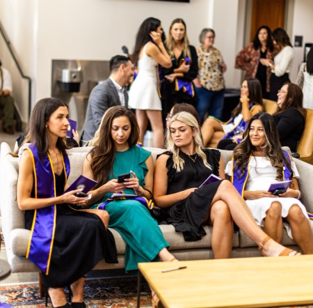 Alumni exchanging contact information