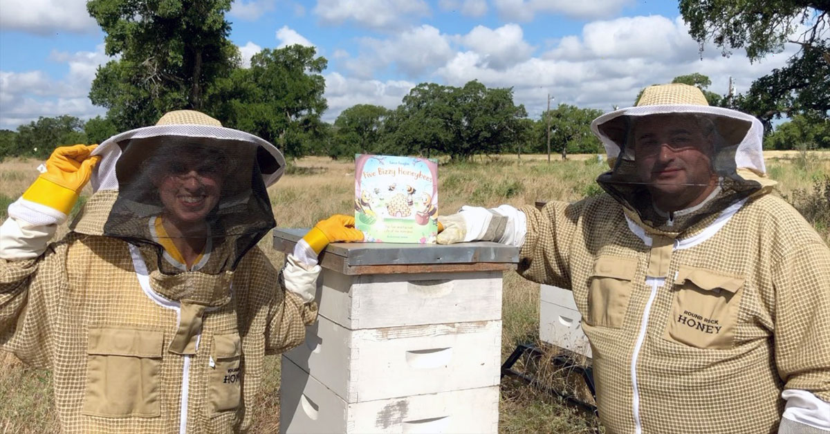 Kassi Kincaid and Five Bizzy Honeybees children's book with Round Rock Honey worker Konrad Bouffard