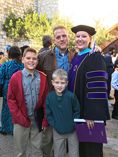 Marianne Rader with family at graduation