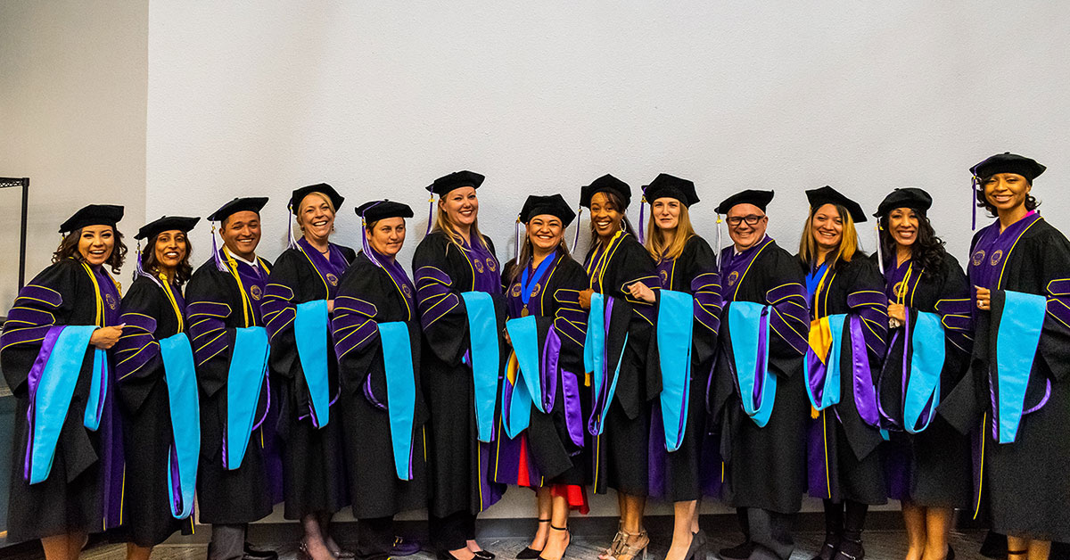 Marianne Rader with graduating class