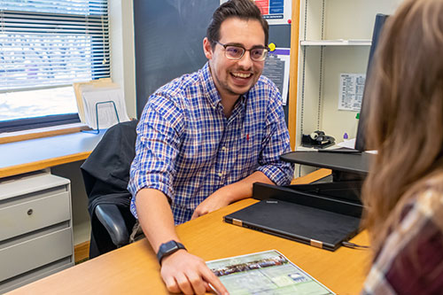 Admissions staff with student