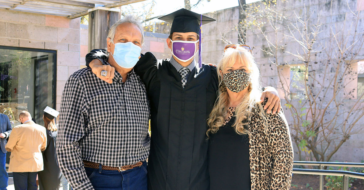 CTX parents with graduate at commencement