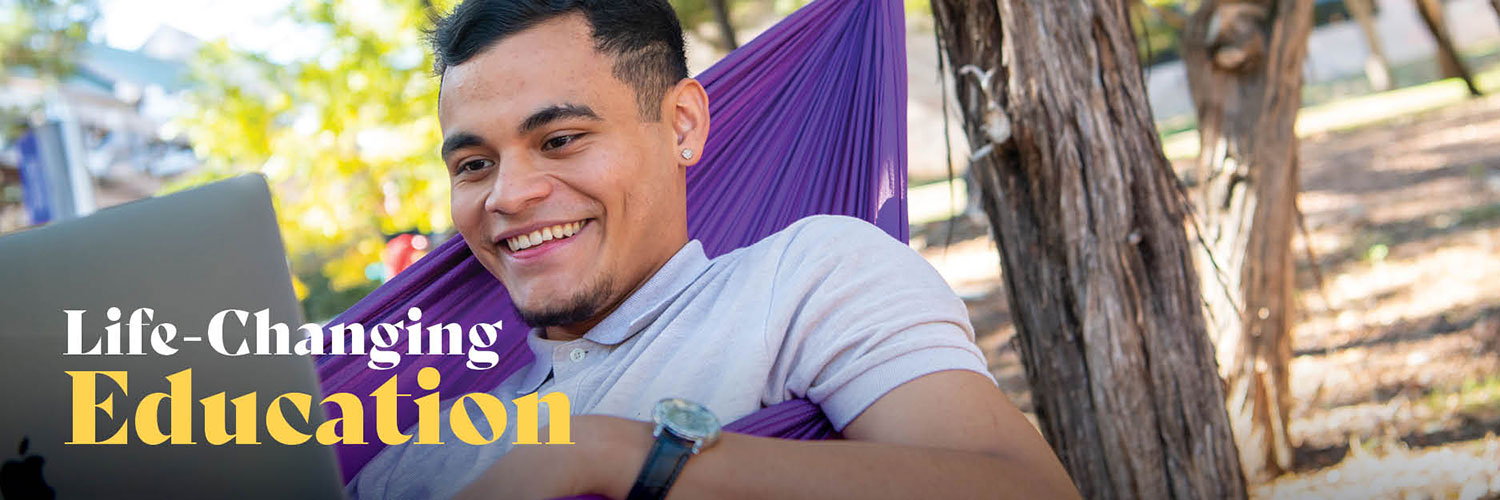 Life-changing Education man in hammock on computer hero