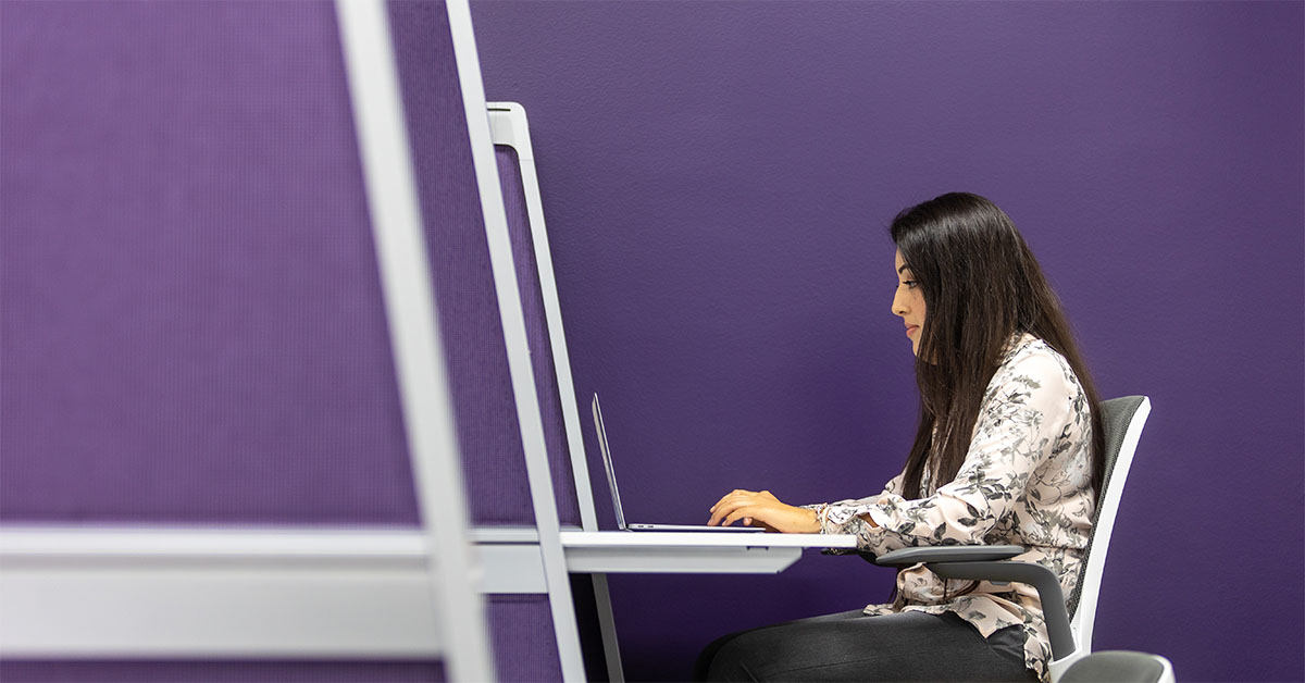 Adult woman working on computer at a desk