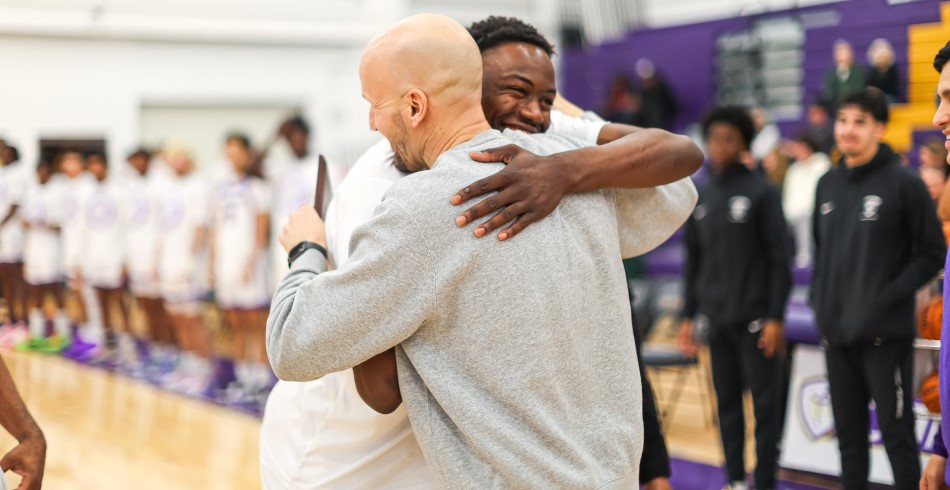 Coach Stan Bonewitz and his student-athletes at a game
