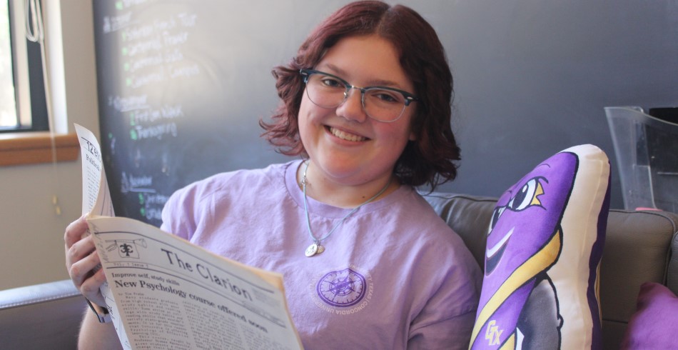 Concordia Texas student reading a newspaper