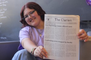 Abby Shaivitz with a copy of The Clarion